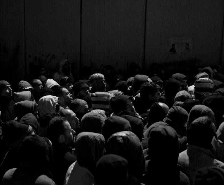 Palestinian commuters waiting at checkpoint 300