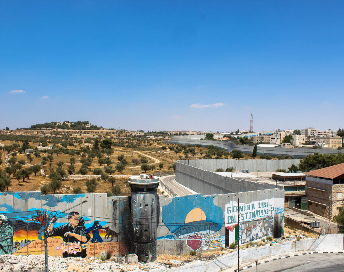 Birds eye view of Qalandia checkpoint and olive fields beyond