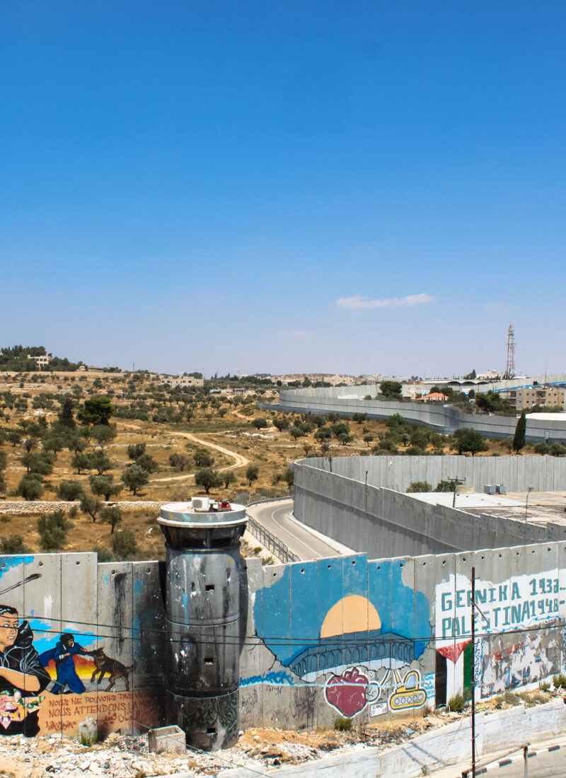 Birds eye view of Qalandia checkpoint and olive fields beyond