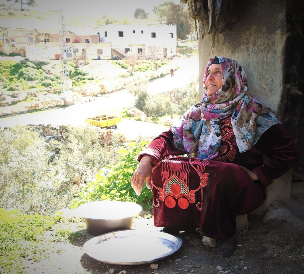 571eefc601f11c8ef12a2990f3619547 A Palestinian woman looks into the sunshine, South Hebron Hills