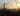 Barbed wire in the foreground, sunset in the background