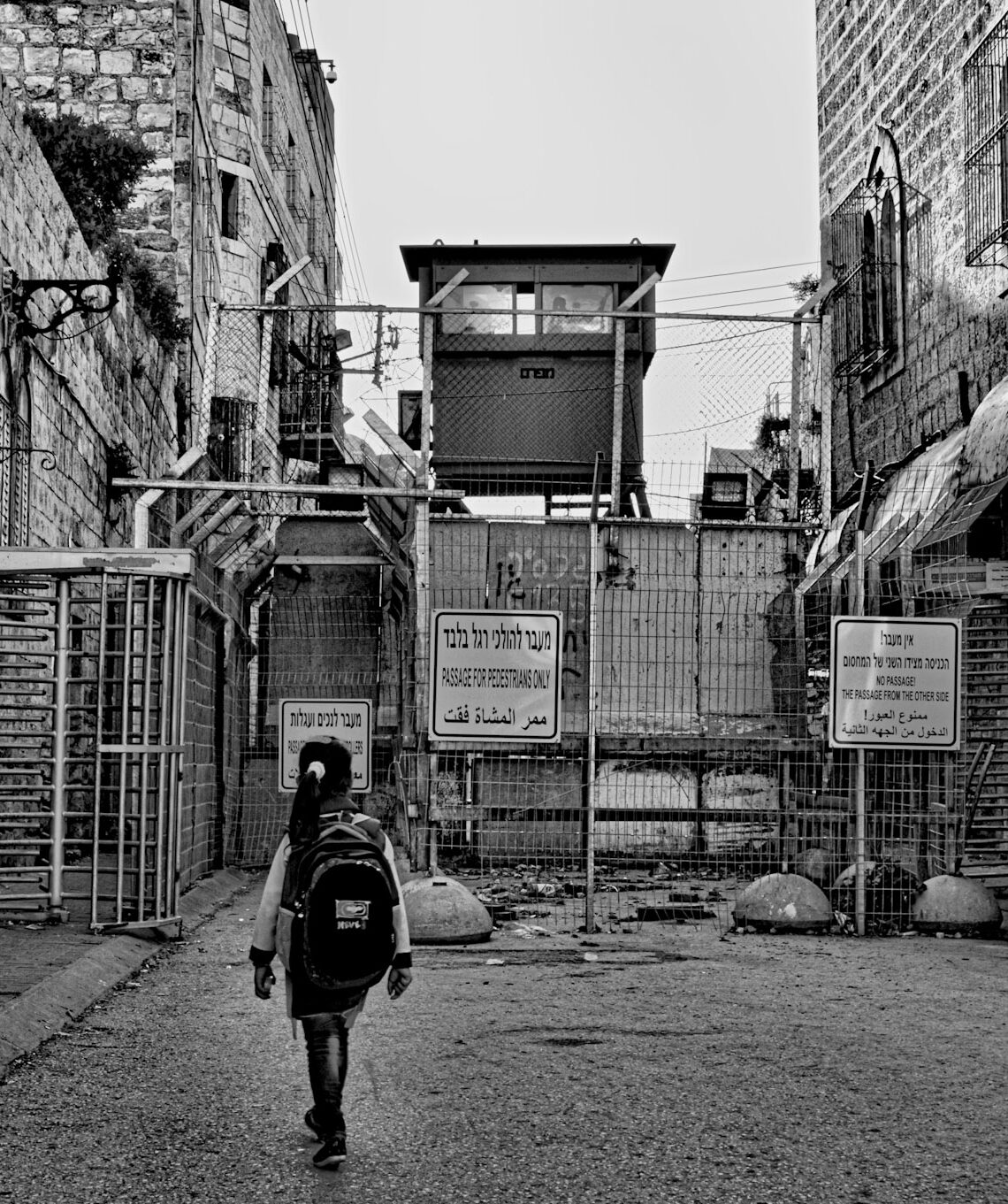 Palestinian child crossing checkpoint in Hebron