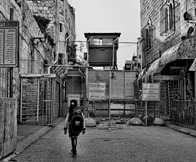 Palestinian child crossing checkpoint in Hebron