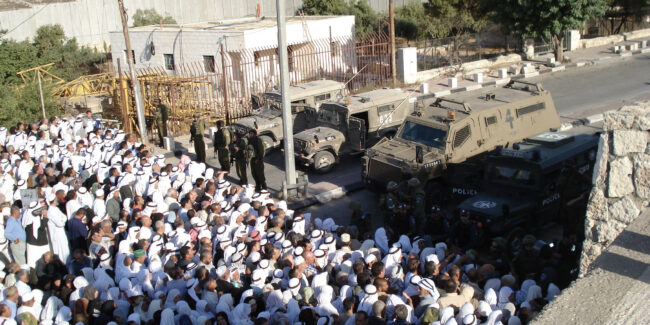 Soldiers block access to worship during Ramadan - preventing Muslims crossing checkpoint 300 in Bethlehem to reach Jerusalam and visit Al Asqa Mosque