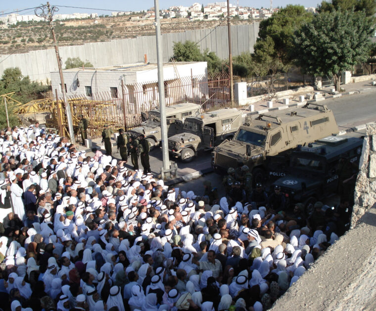 Soldiers block access to worship during Ramadan - preventing Muslims crossing checkpoint 300 in Bethlehem to reach Jerusalam and visit Al Asqa Mosque
