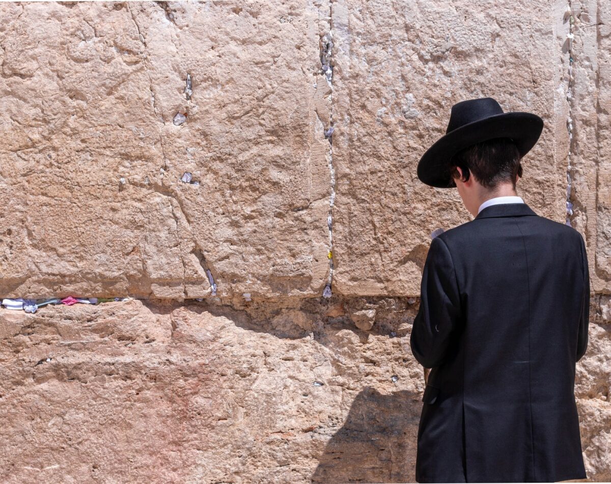 A Jewish man prays at the Western Wall