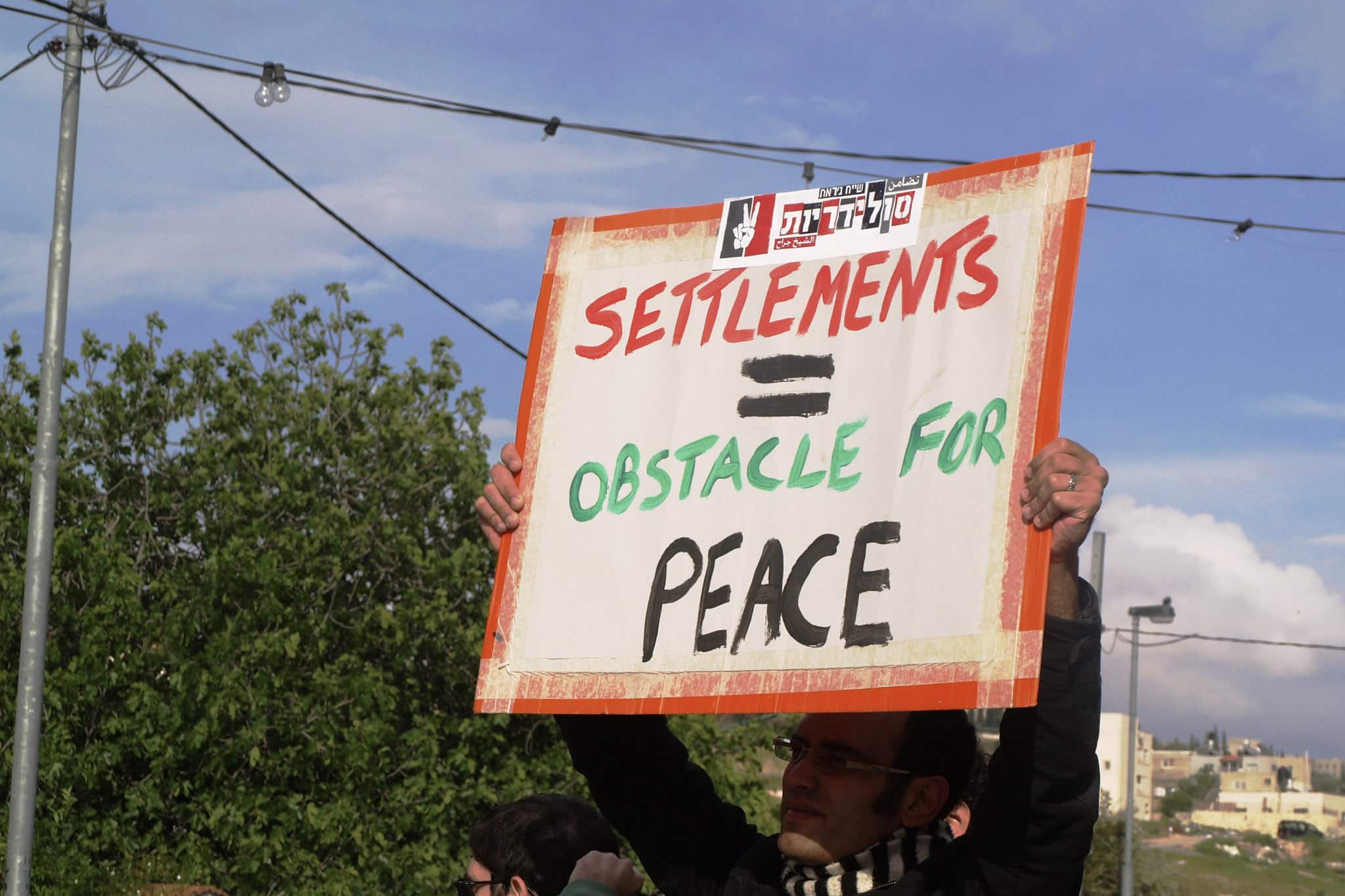 A placard at a demonstration in Jerusalem, Madeleine McGivern, 22 A placard at a demonstration in Jerusalem