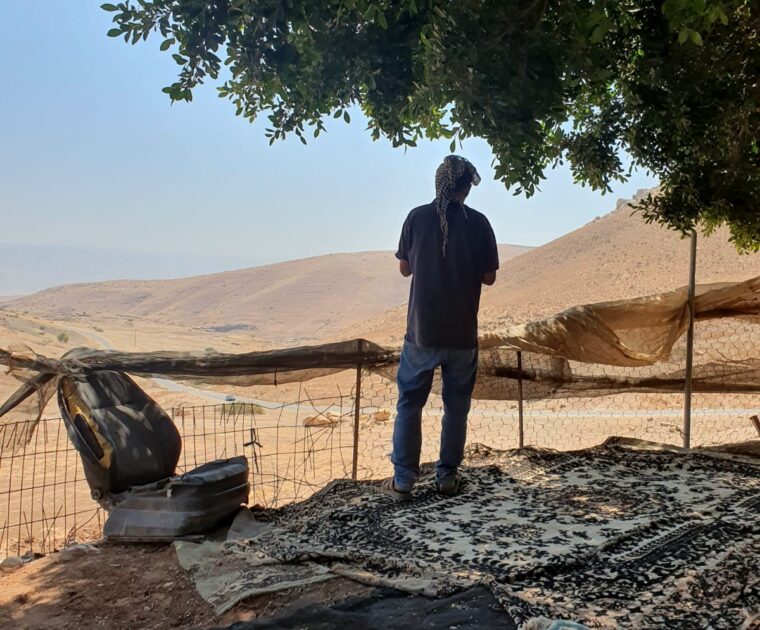Al Bourj - shepherd looks out at pastureland he used to graze freely on