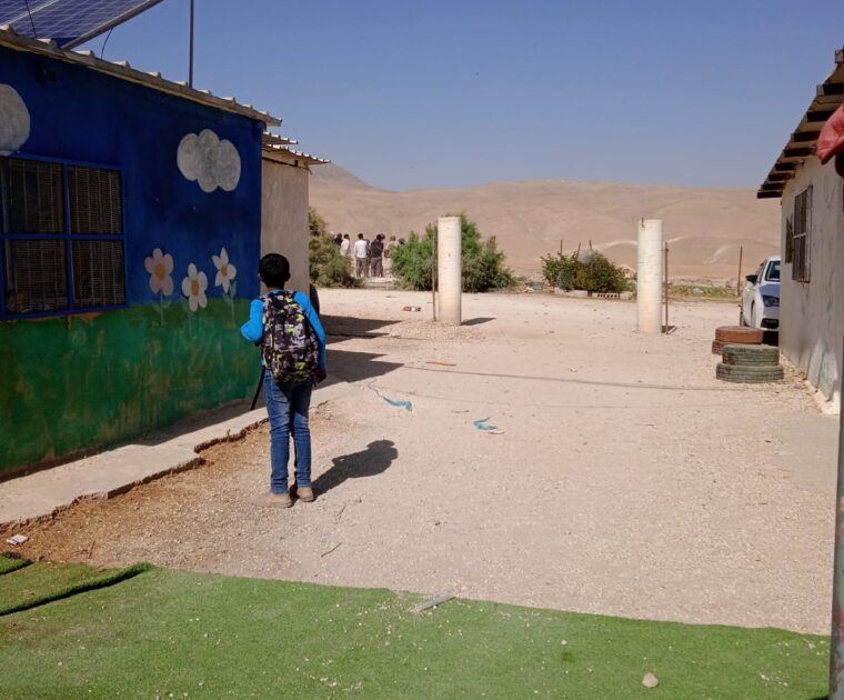 Pupil at al-Muarraja school watches as Israeli soldiers arrive