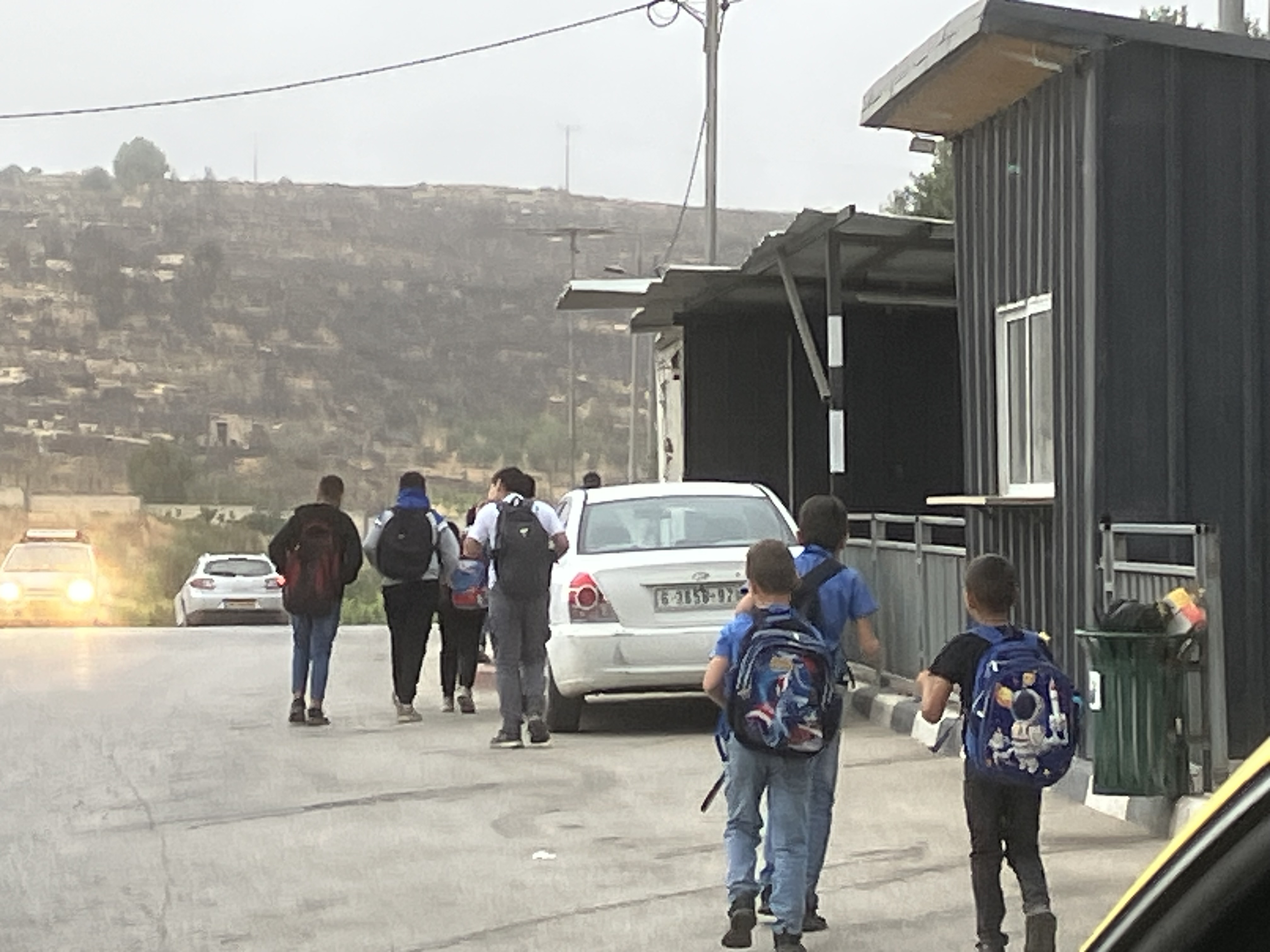 Boys walking to school close up (from the back) Photo 2 Boys walking to school close up (from the back)