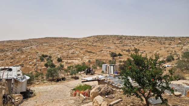 Picture2 Sheikh Saeed’s farm in Masafer Yatta, with the road to the Avigayil settlement in the distance.